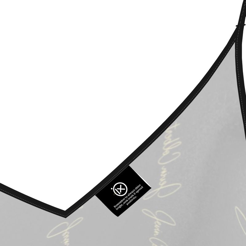 Black satin slip dress strap detail with V-neck seam and small woven label