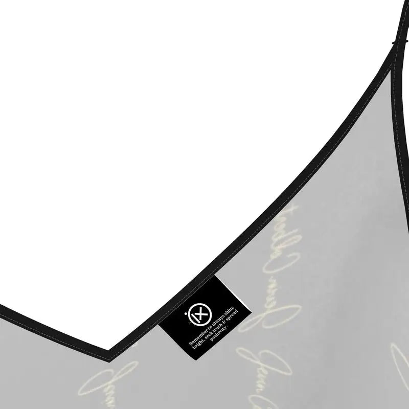 Black satin slip dress strap detail with V-neck seam and small woven label