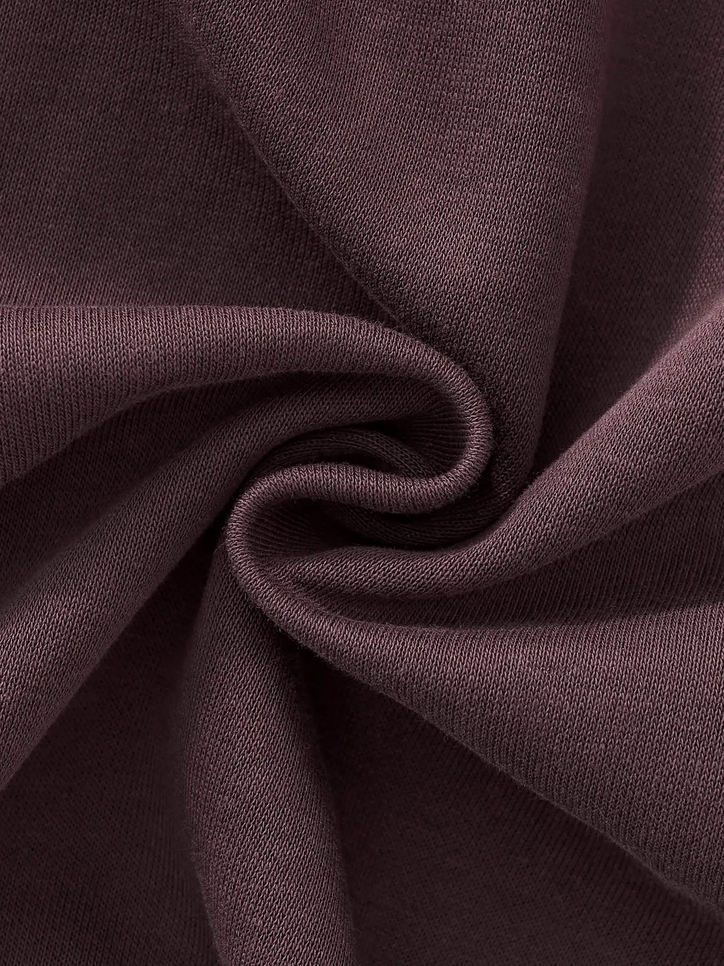 Women’s straight-leg sweatpants fabric, dark purple knit fold close-up