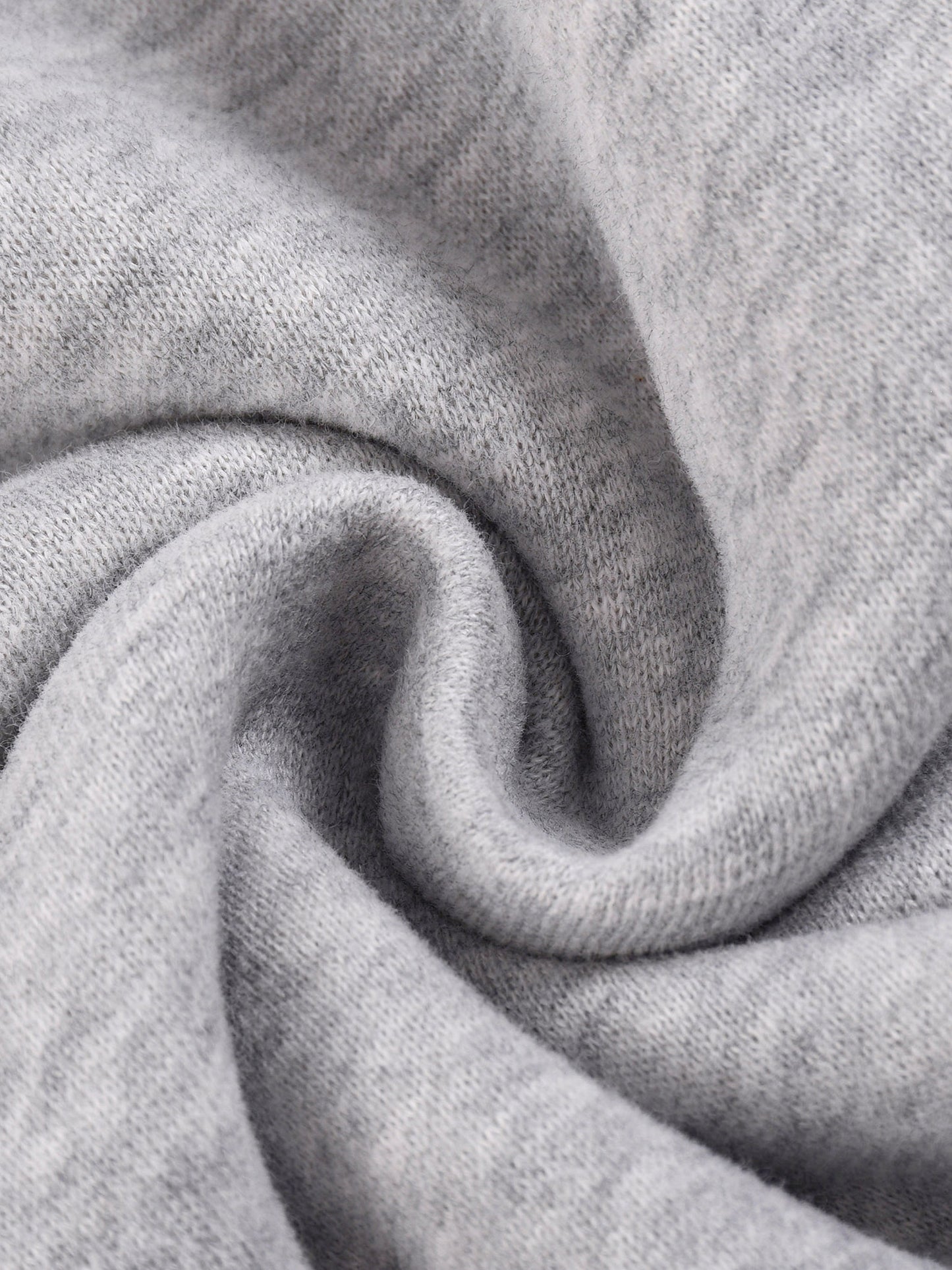 Heather gray knit fleece close-up with folded fabric section