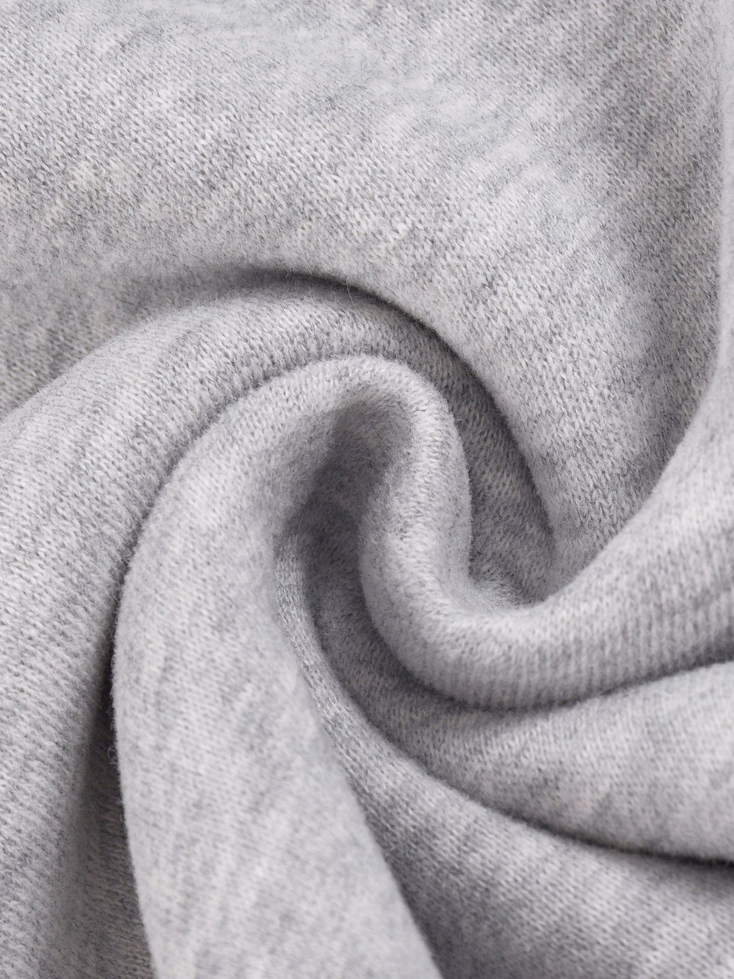 Heather gray knit fabric close-up with folded texture detail