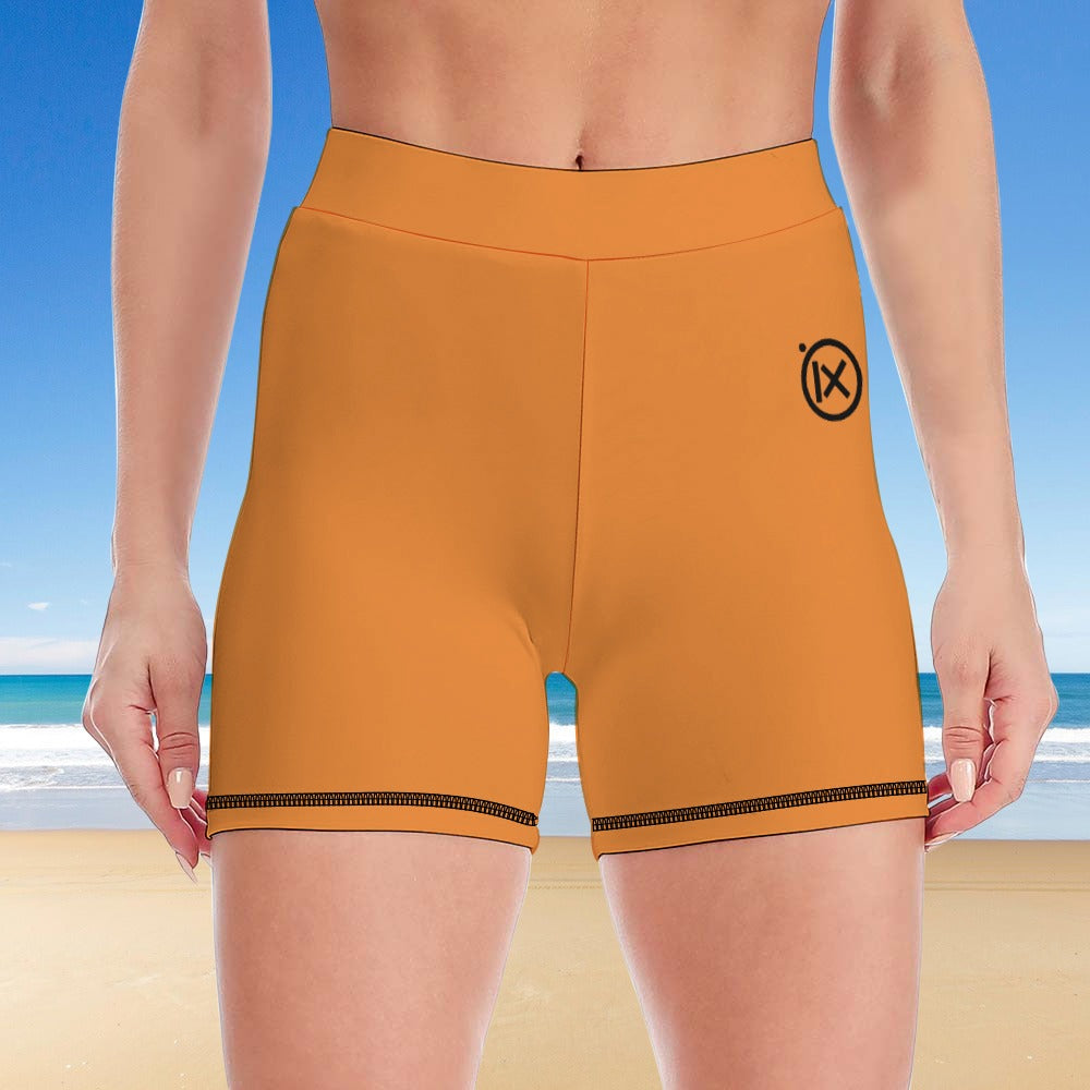 Women's two-piece yoga set, orange shorts with black-trim hem and small logo on leg