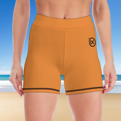 Women's two-piece yoga set, orange shorts with black-trim hem and small logo on leg