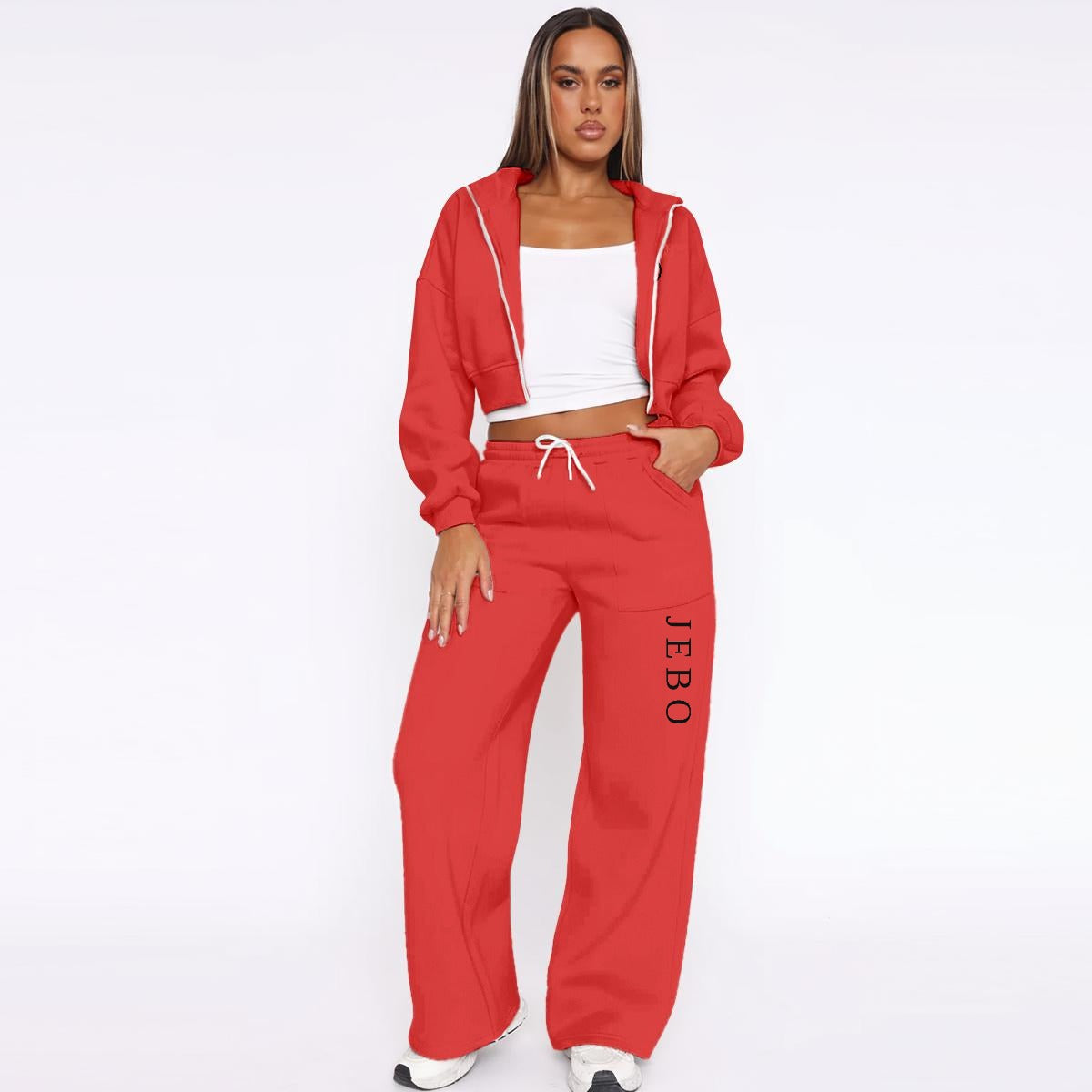 Women’s fleece tracksuit set in red: zip hoodie jacket and drawstring wide-leg pants.