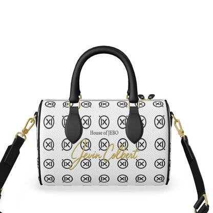Mini duffle bag front view, white with black trim, gold logo print, crossbody strap