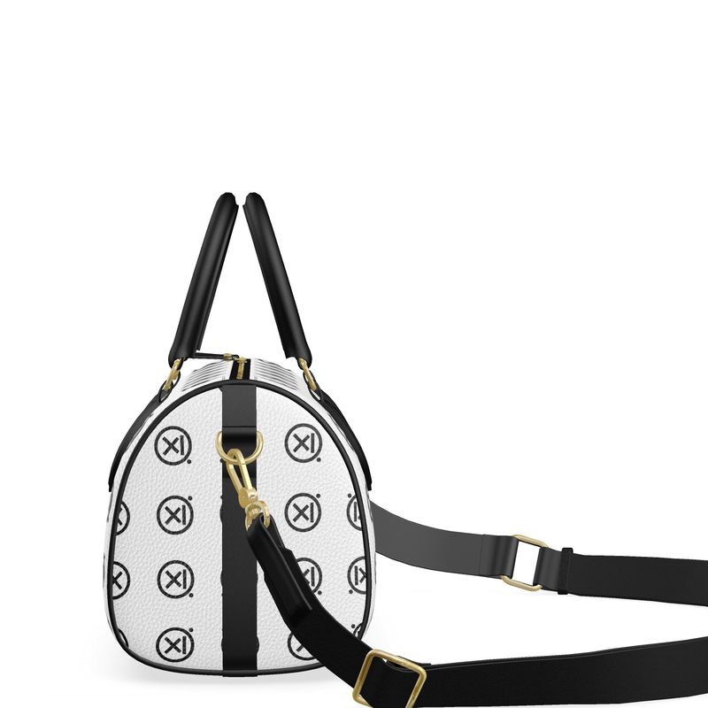 Mini duffle bag side view, white with black trim, long adjustable crossbody strap