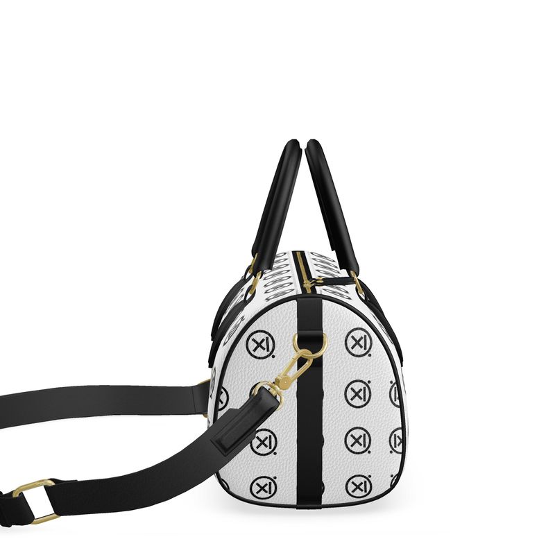 Mini duffle bag back view, white with logo pattern, black crossbody strap and clasp