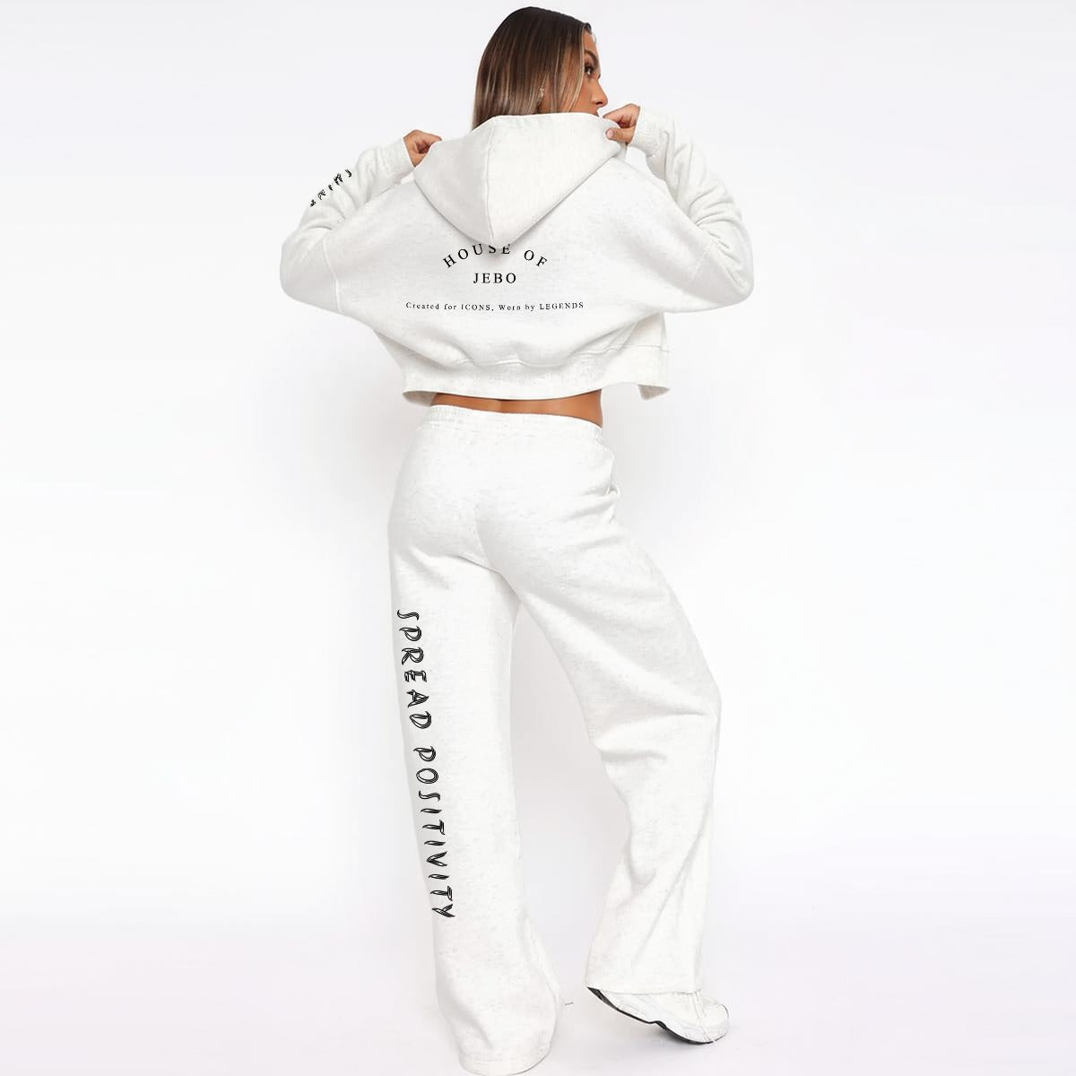 Women’s white fleece tracksuit set with zip hoodie and wide-leg sweatpants, back graphic.