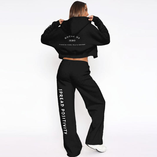 Black fleece zip-up hoodie and wide-leg sweatpants set, front and side view
