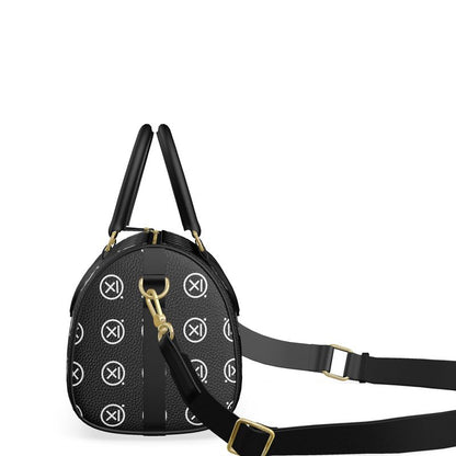 Mini duffle bag on black crossbody strap with gold rings, textured black monogram pattern