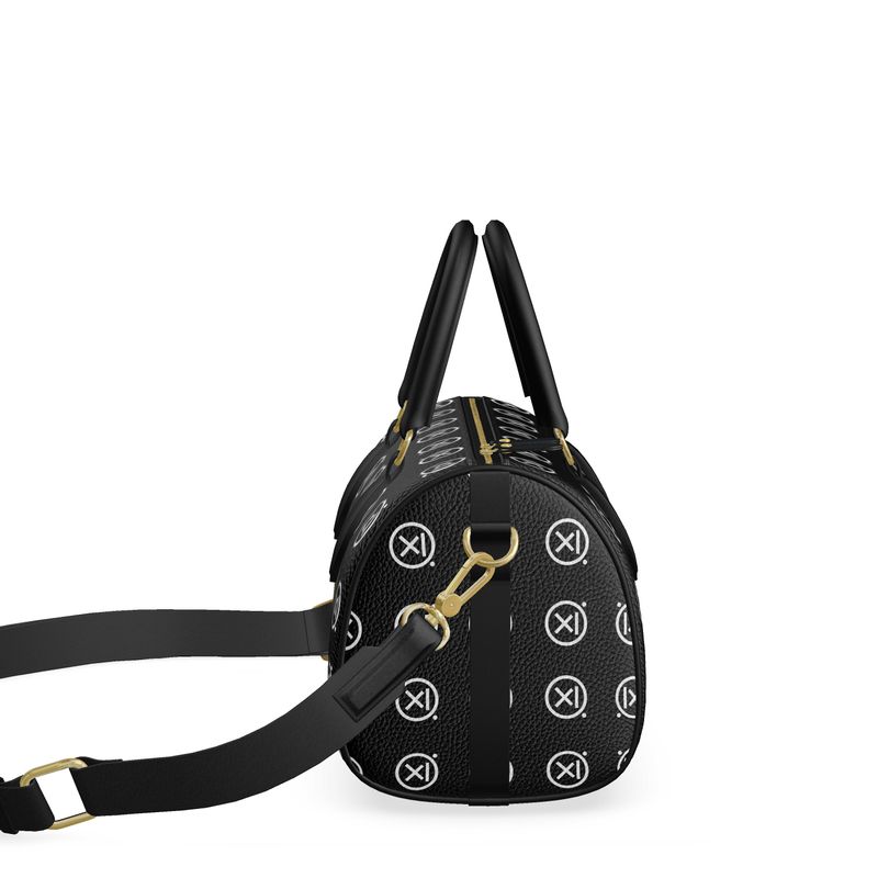 Mini duffle bag with crossbody strap and gold clasp, black textured monogram print
