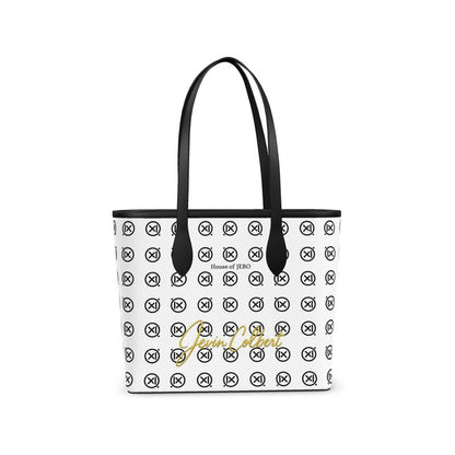 White leather tote with black handles and repeating monogram pattern, House of Jerb