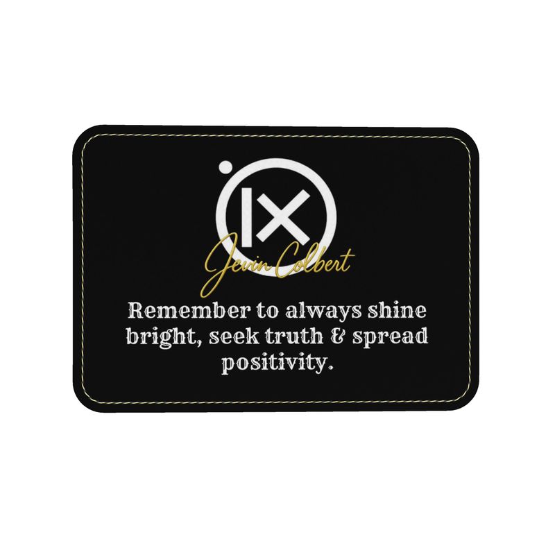 Black leather label patch with Jevin Colbert logo and quote text