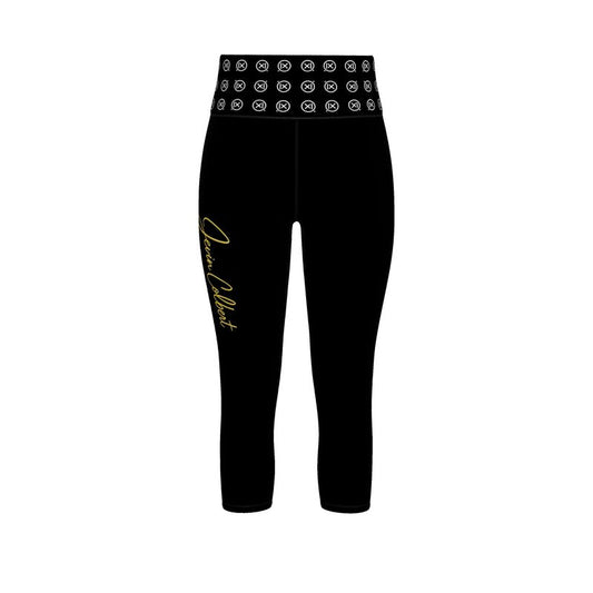 Black sports leggings with patterned waistband and gold script detail on one leg