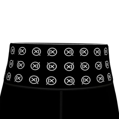 Black waistband with repeating circular icon pattern on sports leggings