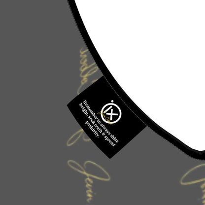 Noir sleeveless midi dress fabric detail with gold script print