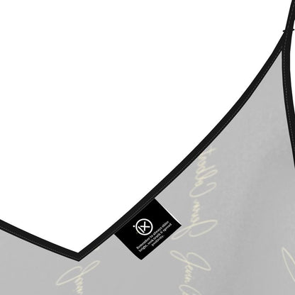 Black satin slip dress strap detail with V-neck seam and small woven label