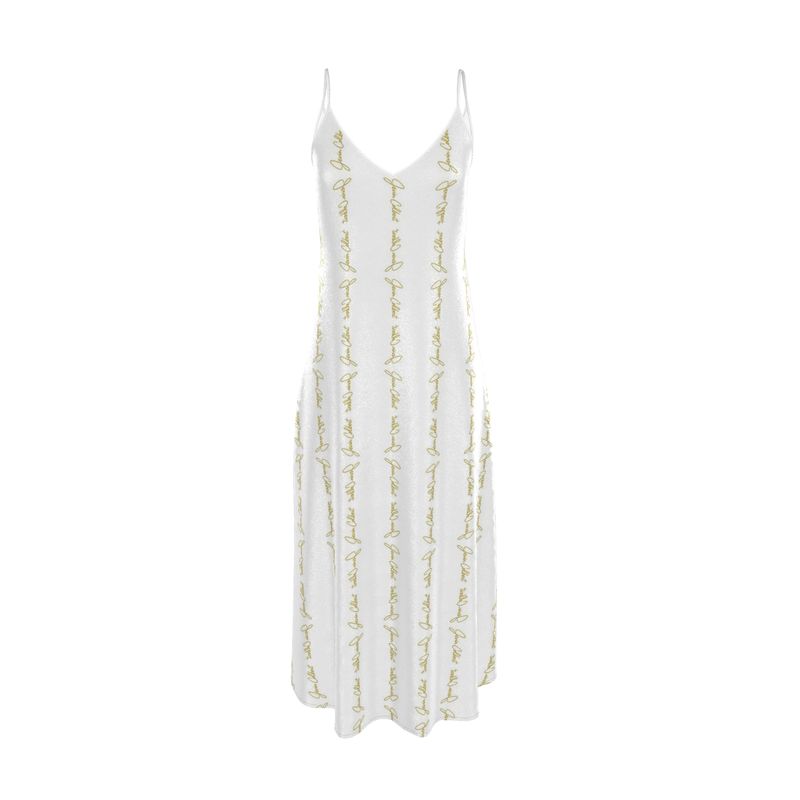 White slip dress with thin spaghetti straps and allover gold script embroidery