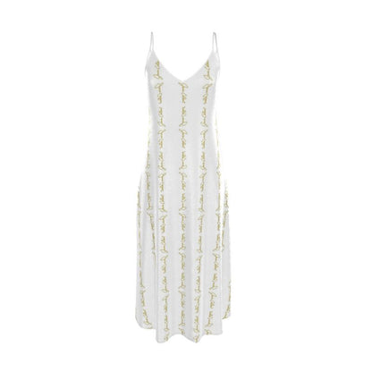 White slip dress with thin spaghetti straps and allover gold script embroidery
