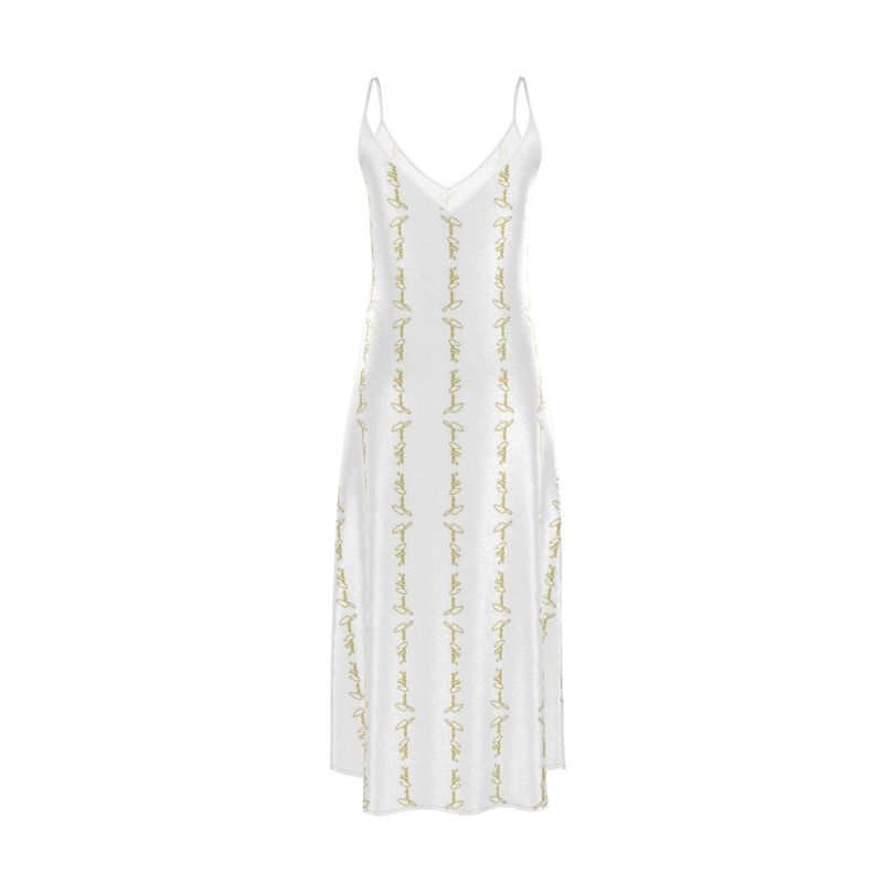 White slip dress with V-neckline, thin straps, and gold script embroidery detail