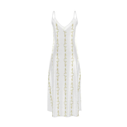White slip dress with V-neckline, thin straps, and gold script embroidery detail