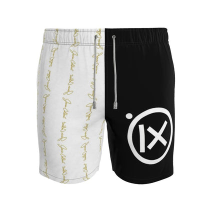 Two-tone men's swim shorts, black and white with gold script and drawstring
