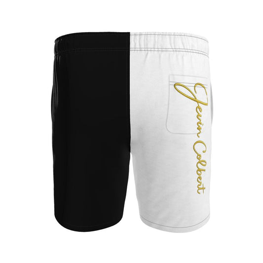 Two-tone men's swim shorts with black left, white right, gold script, zip pocket