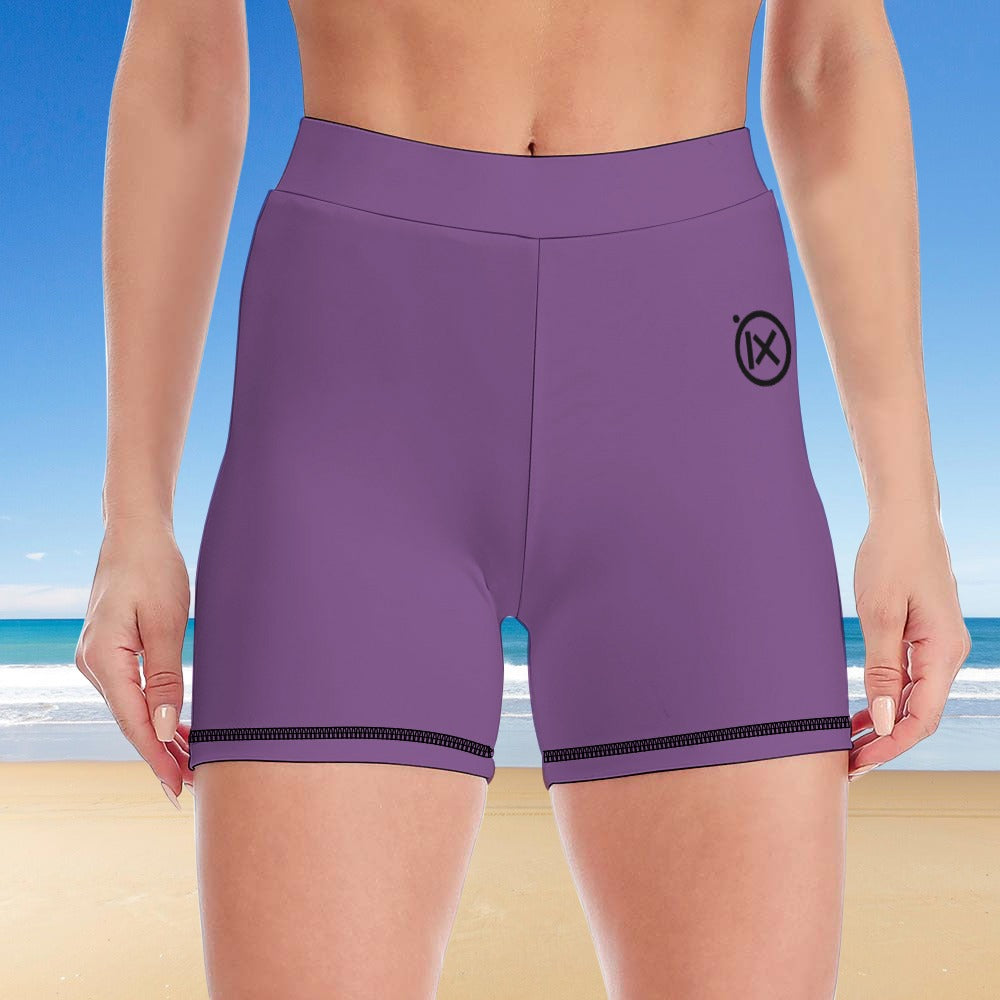 Purple high-waist yoga shorts with black trim and small side logo mark