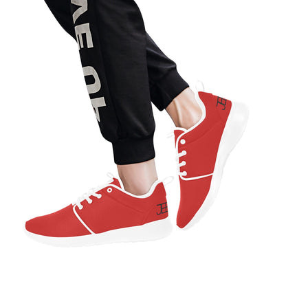 Red mens runner sneakers with white trim, worn with black pants