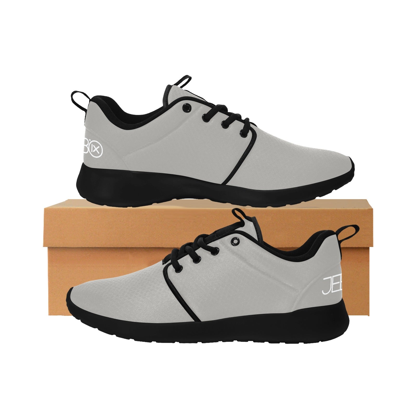 Mens performance running shoes, gray lace-up on box, black sole and logo details