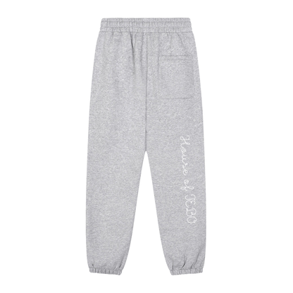 Heather gray joggers with side logo text, back patch pocket, and elastic ankle cuffs