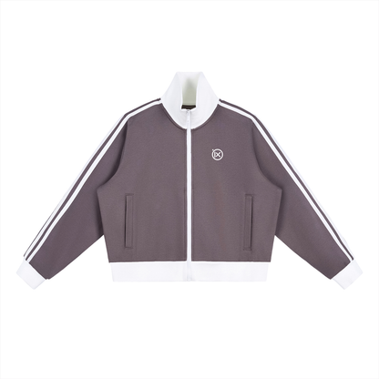 Purple cropped track jacket front with full zip, contrast side stripes, flap pockets