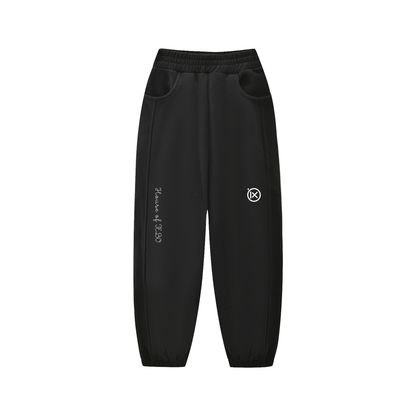 Kids fleece jogger in black with elastic waistband, side pockets, cuffed hem