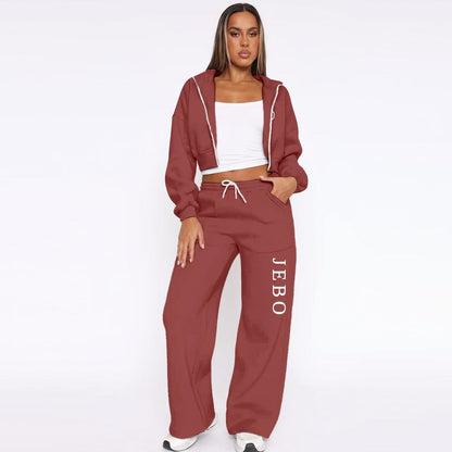 Maroon fleece tracksuit: zip hoodie and drawstring wide-leg joggers with vertical logo text.