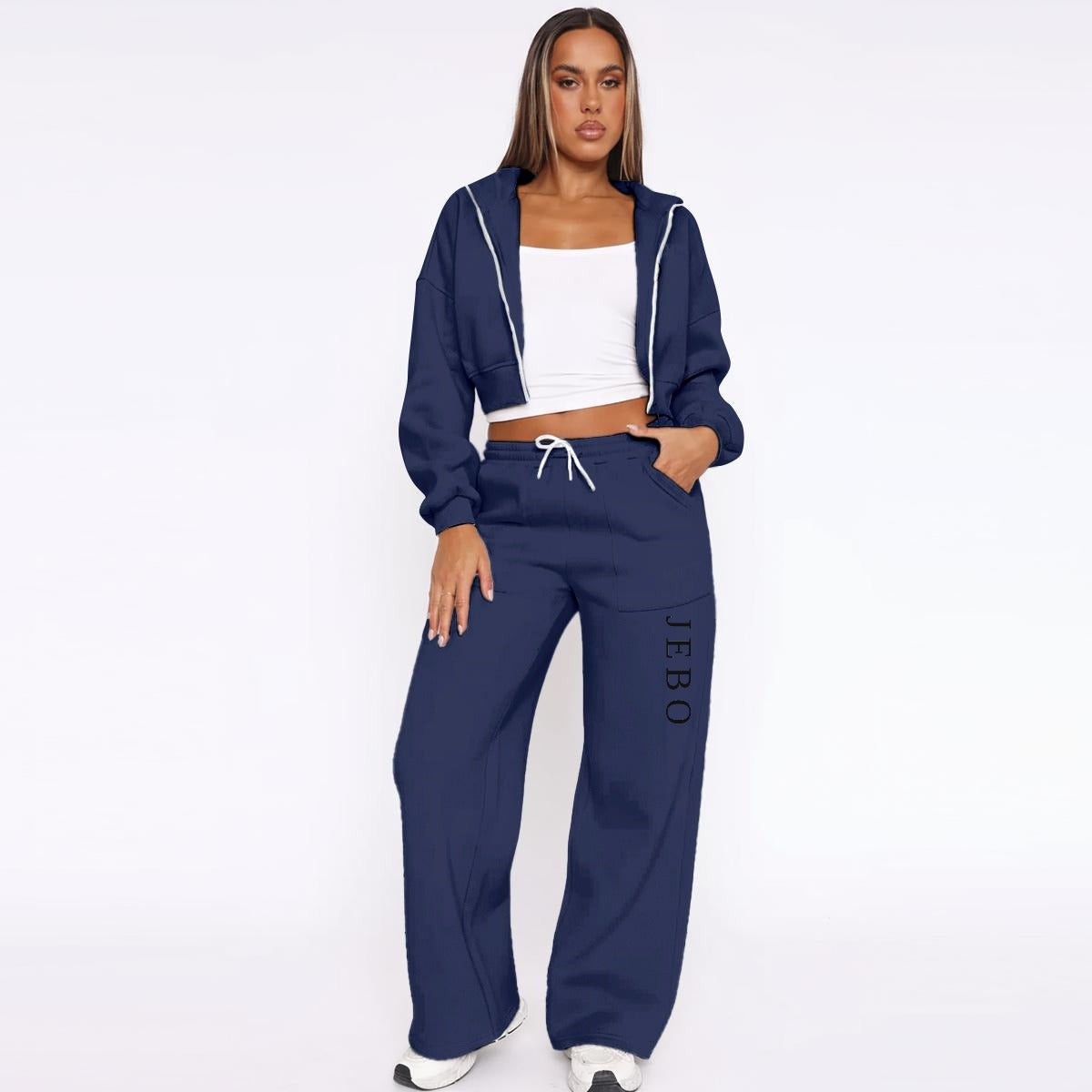 Women’s fleece tracksuit in navy: zip-up hoodie with hood and drawstring wide-leg pants.