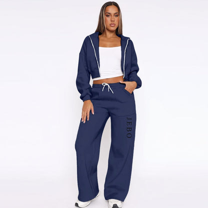 Women’s fleece tracksuit in navy: zip-up hoodie with hood and drawstring wide-leg pants.