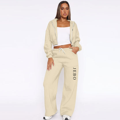 Women’s beige fleece tracksuit set with zip hoodie and drawstring wide-leg sweatpants.