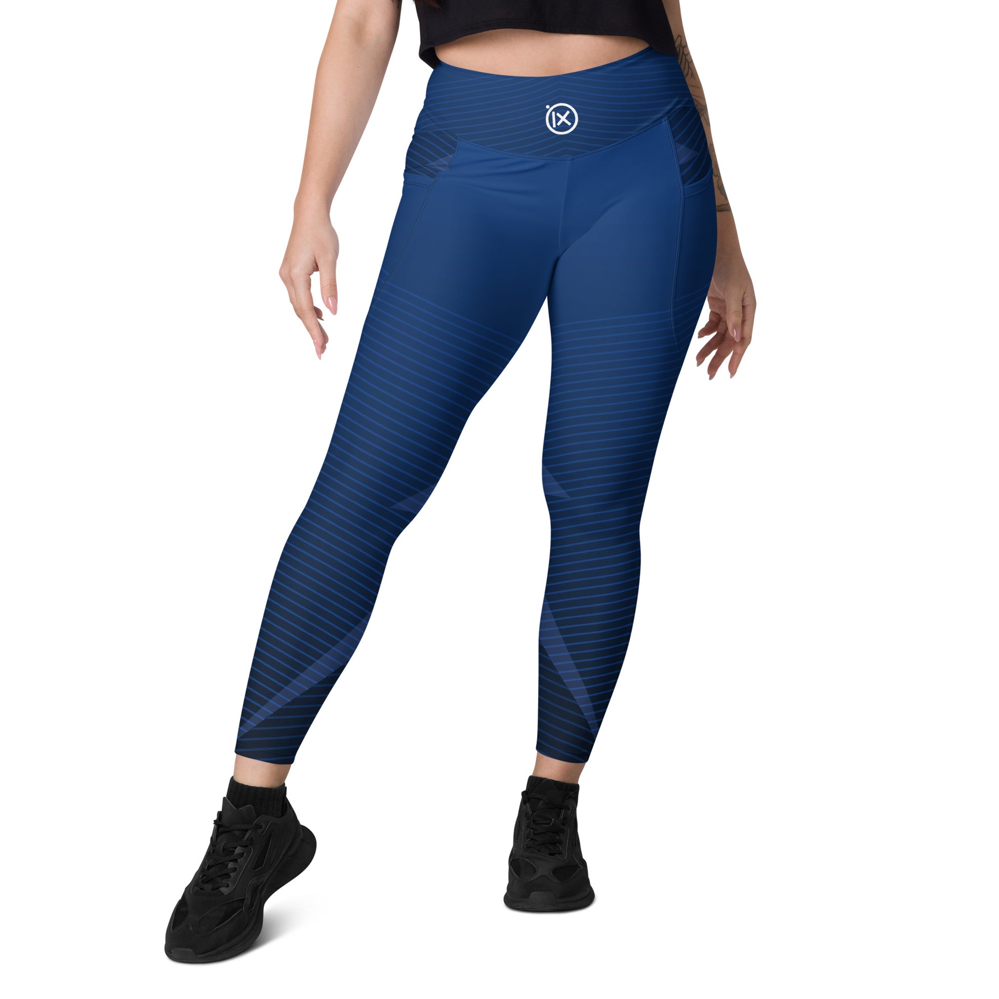 Blue diagonal stripe performance leggings with side pocket openings and contoured leg panels.