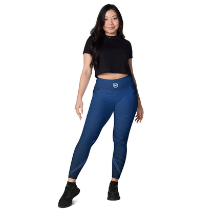 Blue performance leggings with diagonal stripe pattern and small waist logo, ankle length.