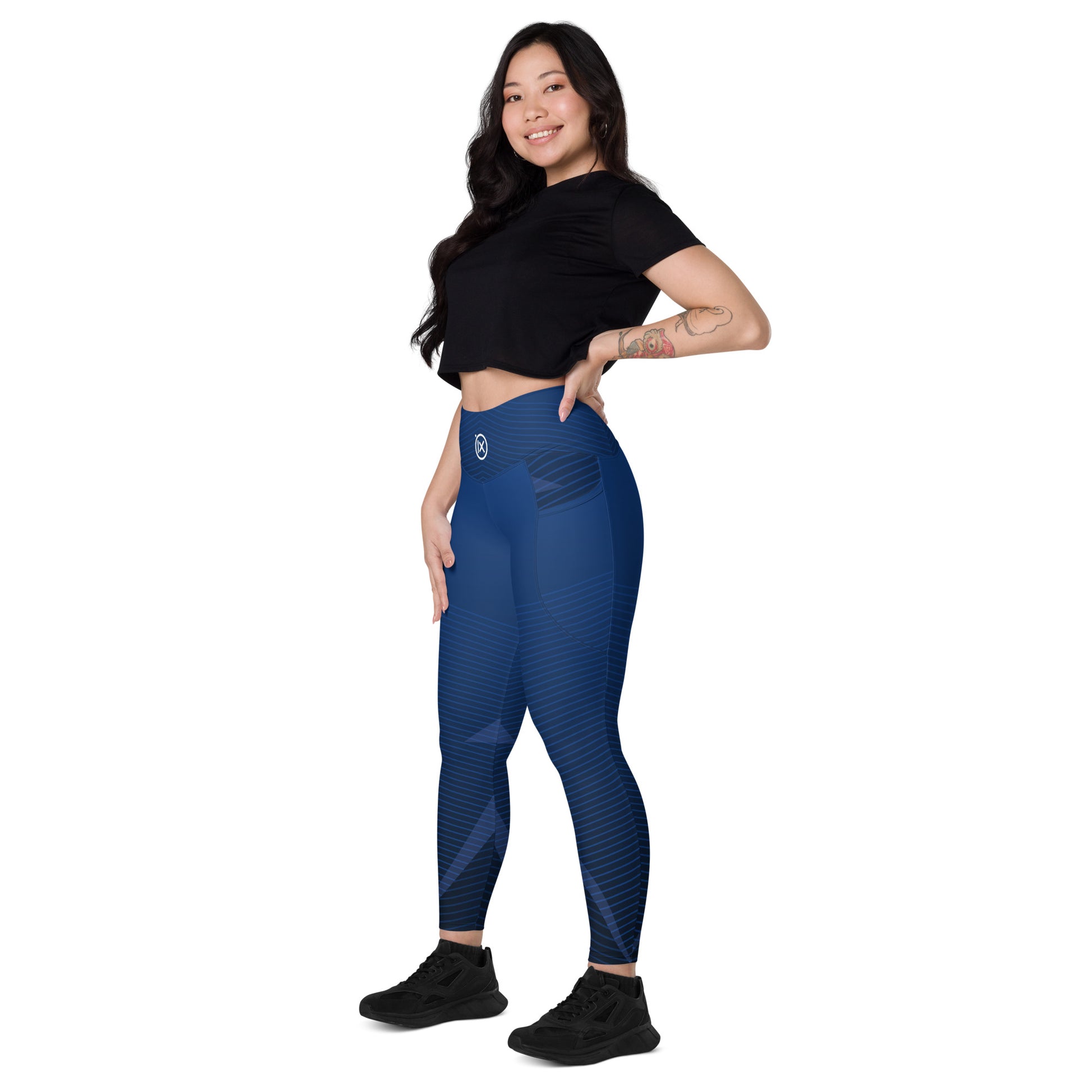 Blue patterned performance leggings with small back logo and diagonal stripe design, ankle length.
