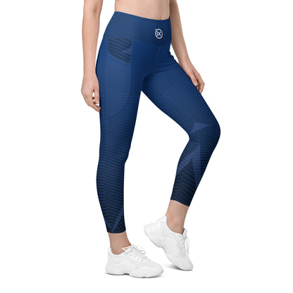 Dark blue 3/4 performance leggings with geometric stripe pattern and contoured fit