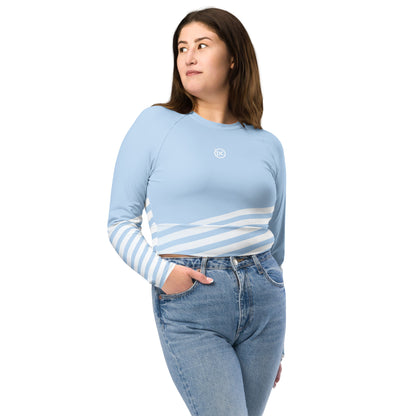 Light blue long-sleeve crop top with white-and-blue striped band across midsection