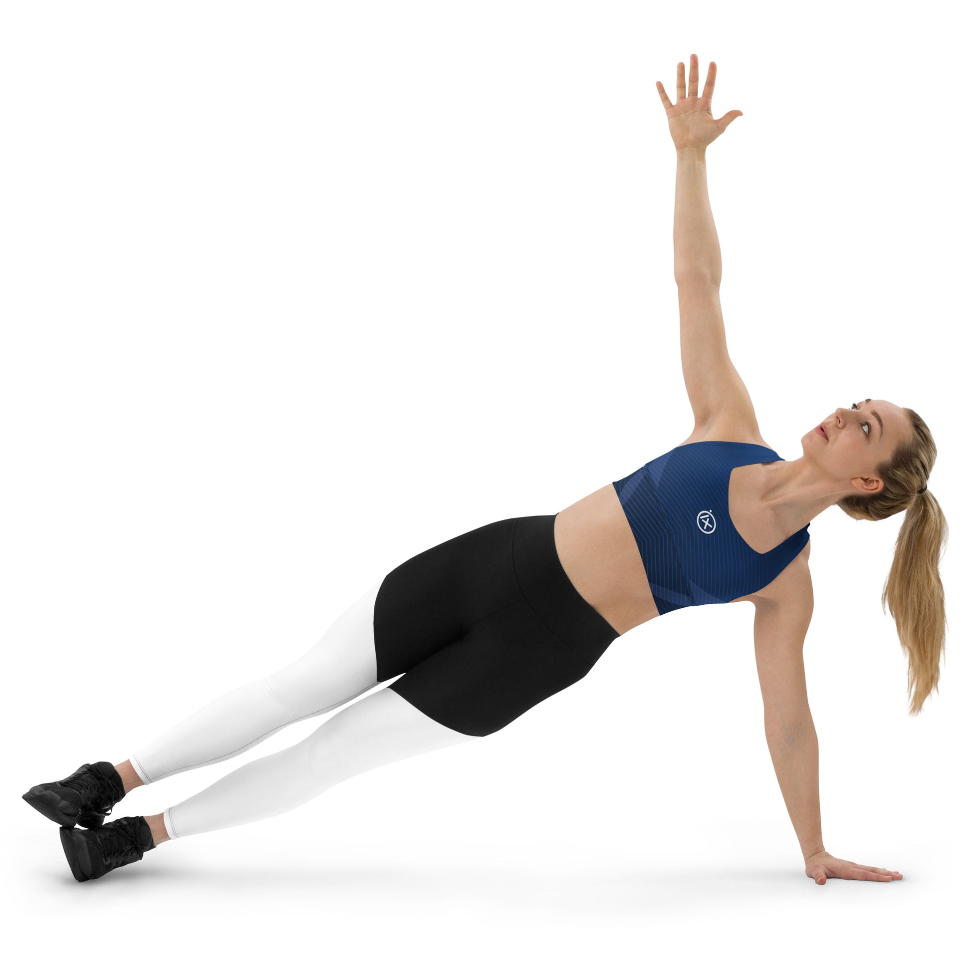 Blue patterned sports bra with scoop neckline and wide straps, ix logo on chest during yoga.