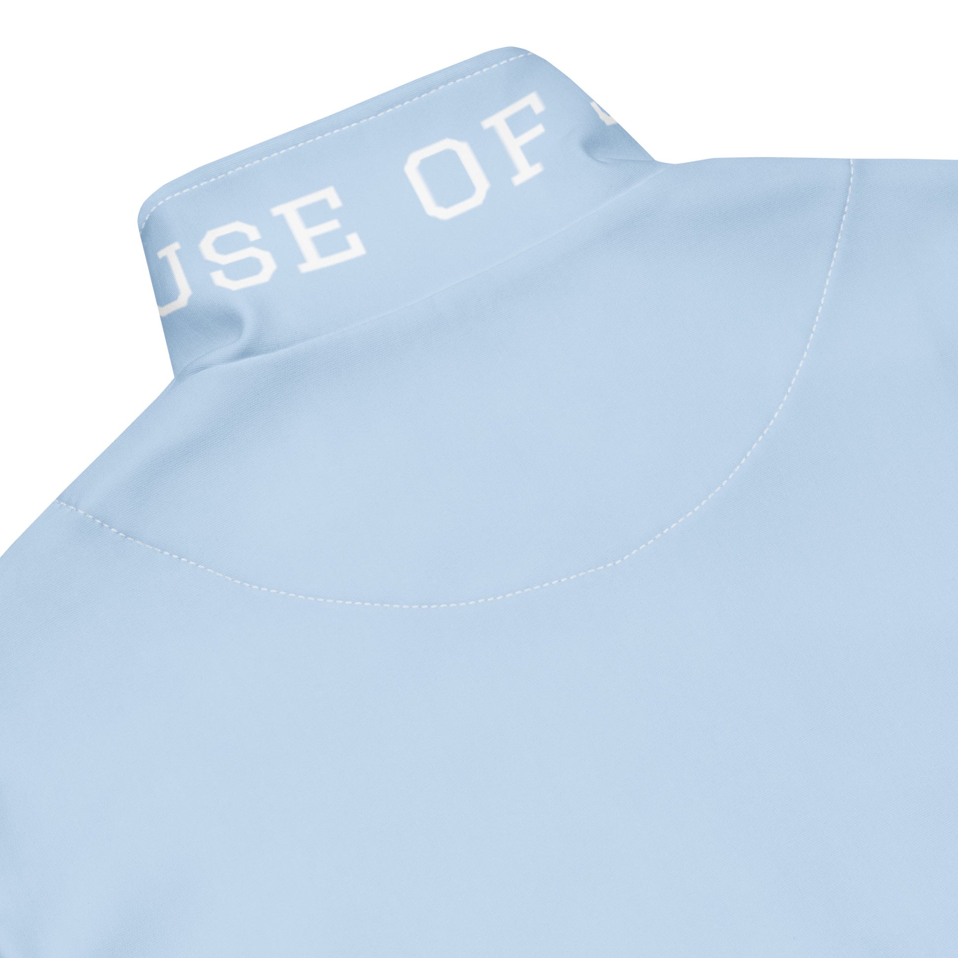Light blue track jacket collar with printed lettering and stitched seam