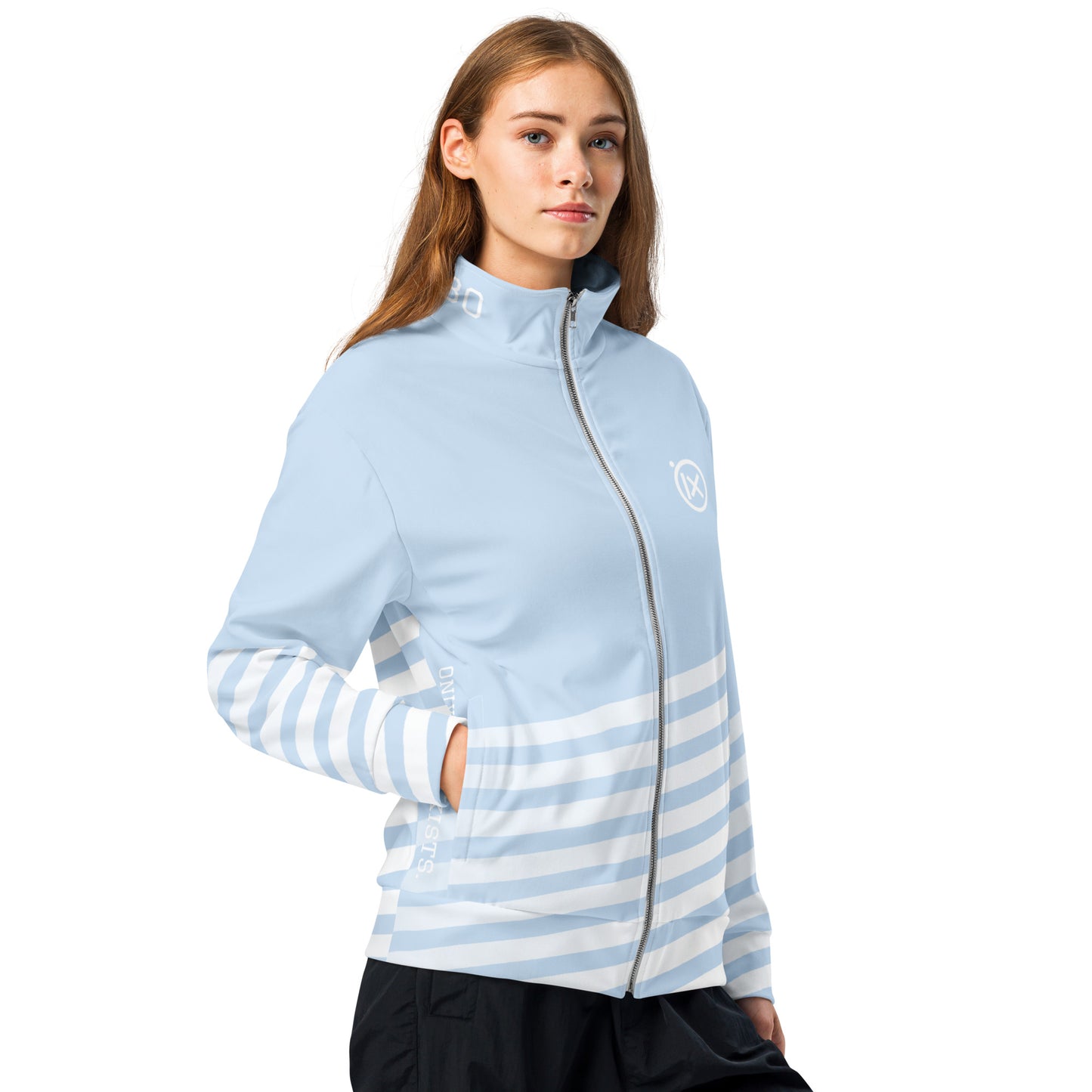 Woman wearing light blue track jacket with full zip and horizontal striped lower sleeves