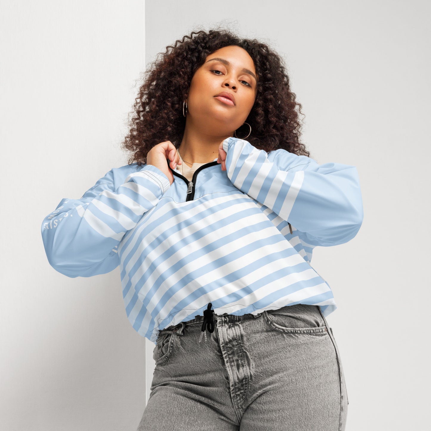 Light blue windbreaker with striped front, hood, and center zip closure