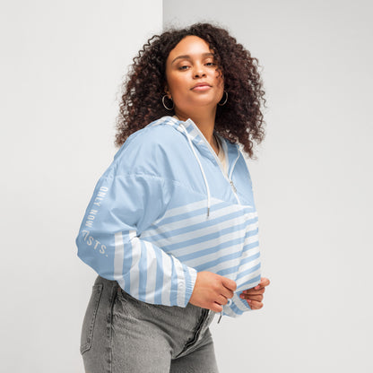 Cropped windbreaker in light blue with white stripes, quarter-zip front and hood