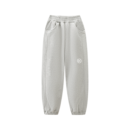 Kids fleece jogger in light gray with elastic waistband, side pockets, cuffed hem