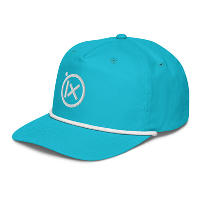 Turquoise golf snapback cap with white rope trim and circular X logo on side.