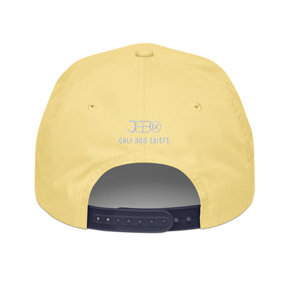 Yellow snapback cap back panel with circular logo and text, plus adjustable strap.